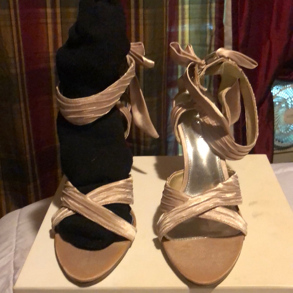 Cream colored open toe pumps